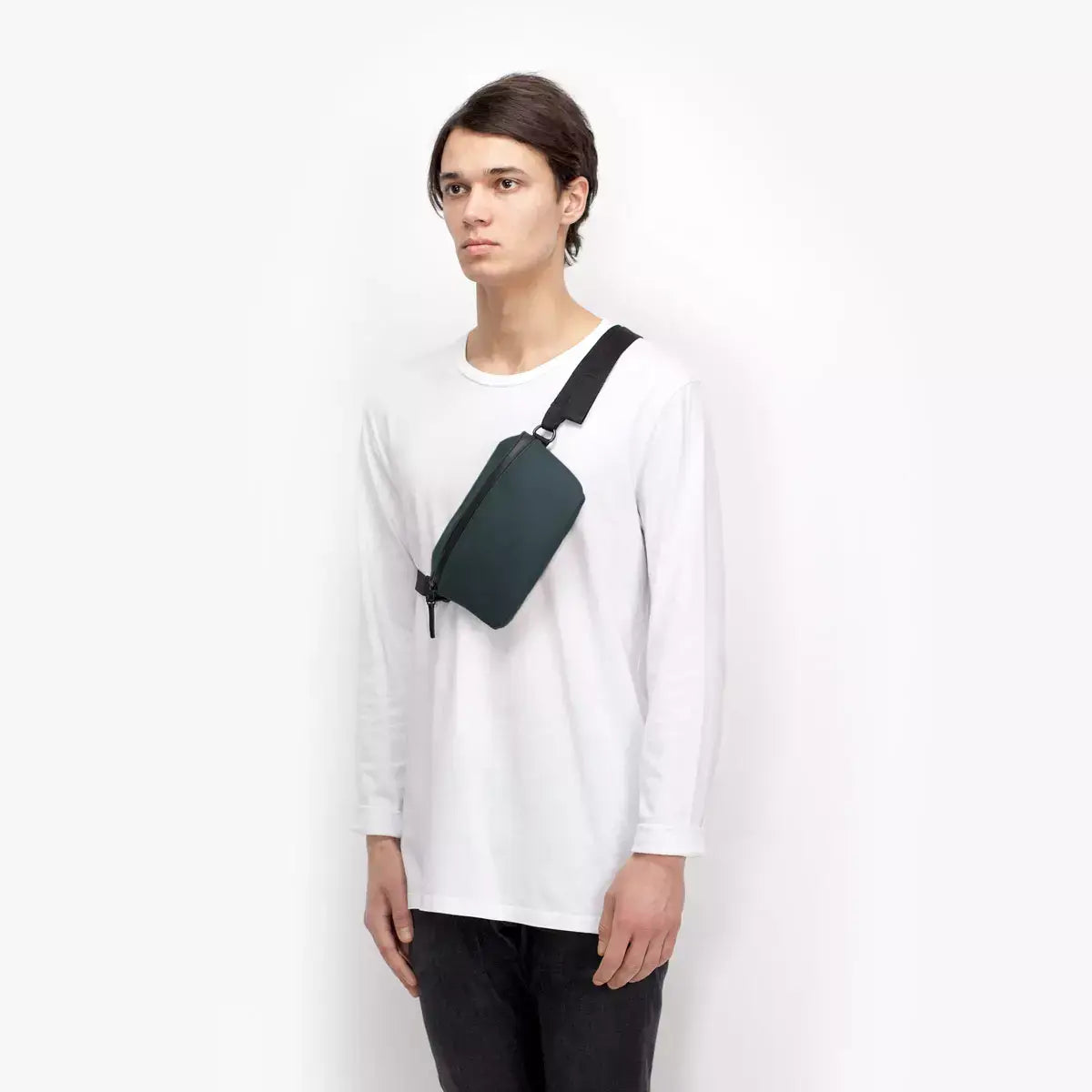 Jona Lotus Infinity Forest Bum Bag worn by a model in casual attire, showcasing its sleek design and functionality.