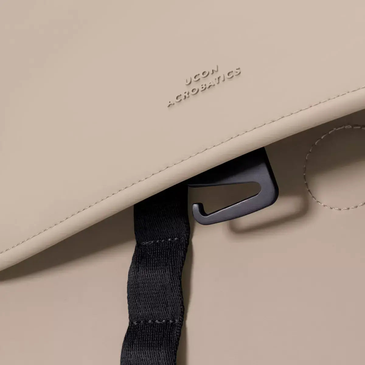 Kumo Medium Lotus Infinity Sand Backpack magnetic closure and strap detail close-up.