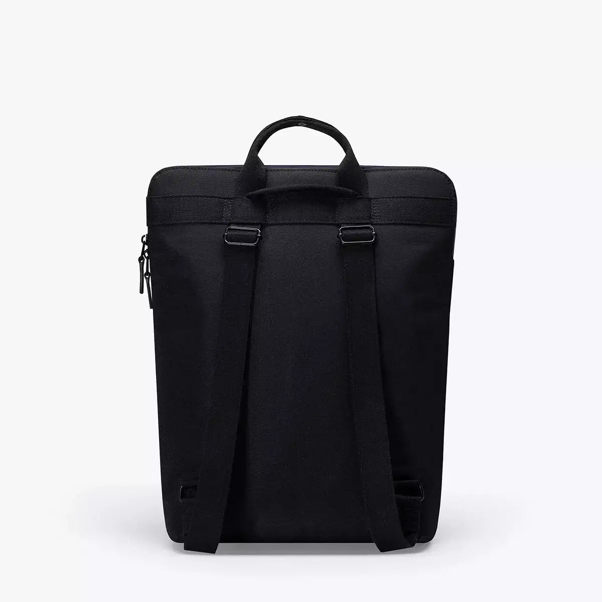 Masao Lotus Dark Navy Backpack showing its sleek black design and adjustable straps, perfect for everyday use.