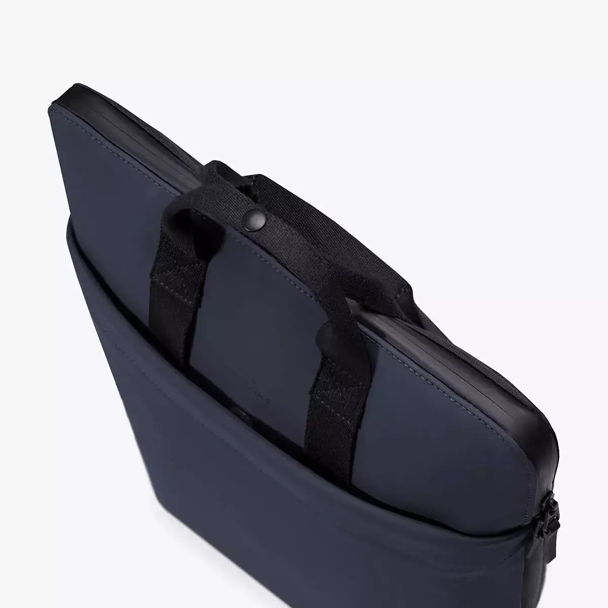 Masao Lotus Dark Navy Backpack showing laptop compartment and durable handles.