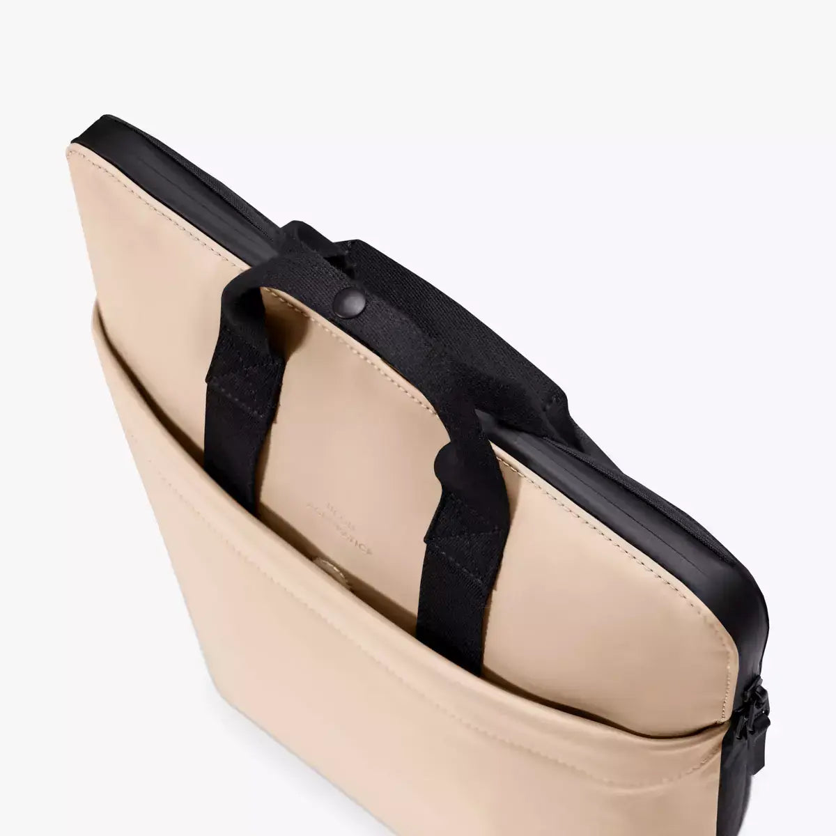 Masao Lotus Light Almond Backpack displayed with laptop compartment and black handles for versatility.