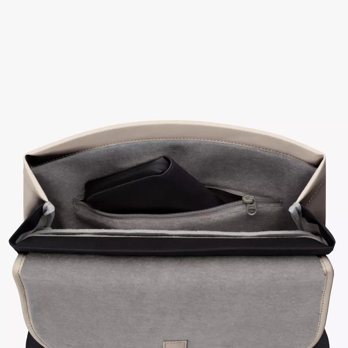 Interior view of Mion Mini Lotus Infinity Light Sand Backpack showing padded compartment and zip pocket.