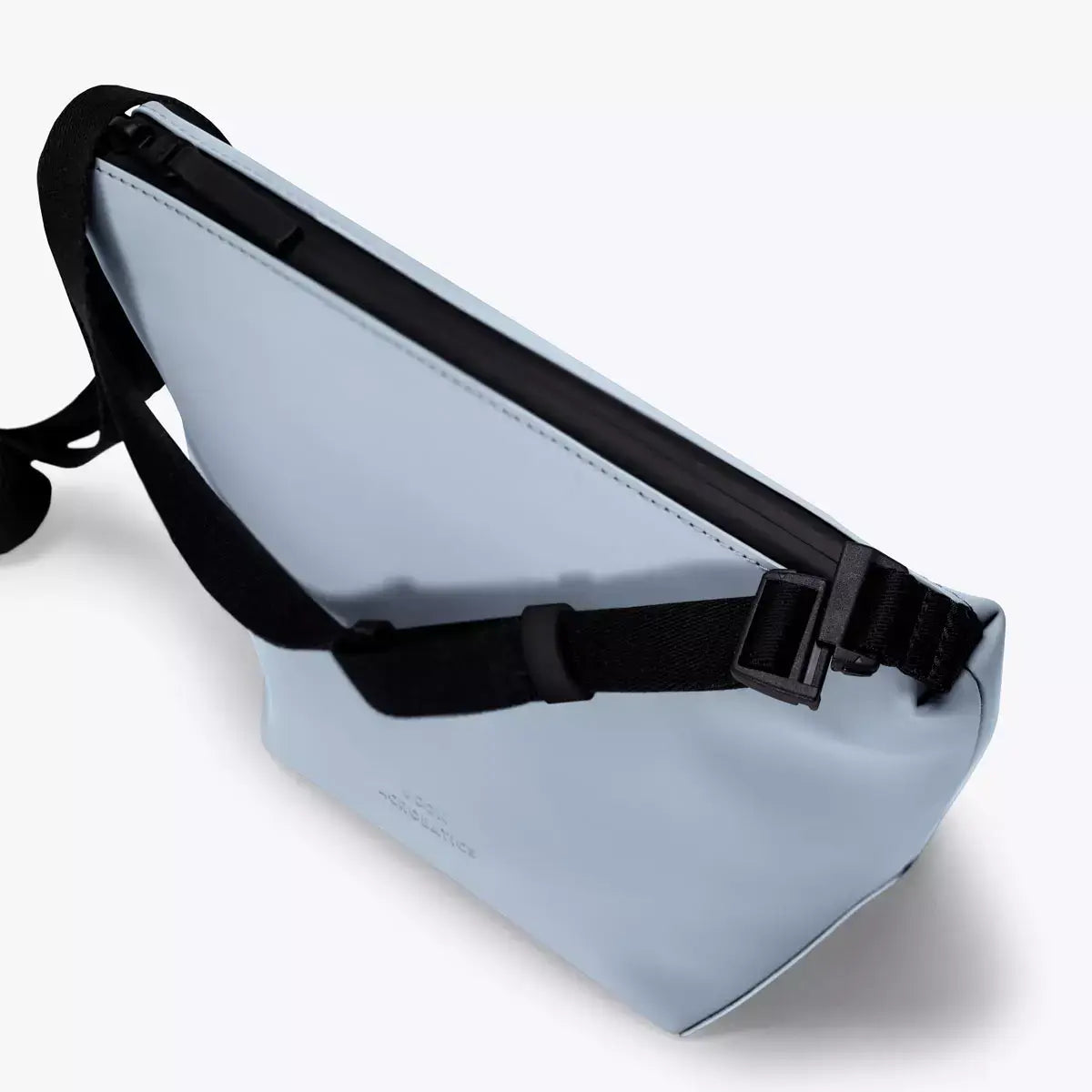 Nola Lotus Fog Blue Shoulder Bag viewed from above, showcasing its sleek design and adjustable strap.