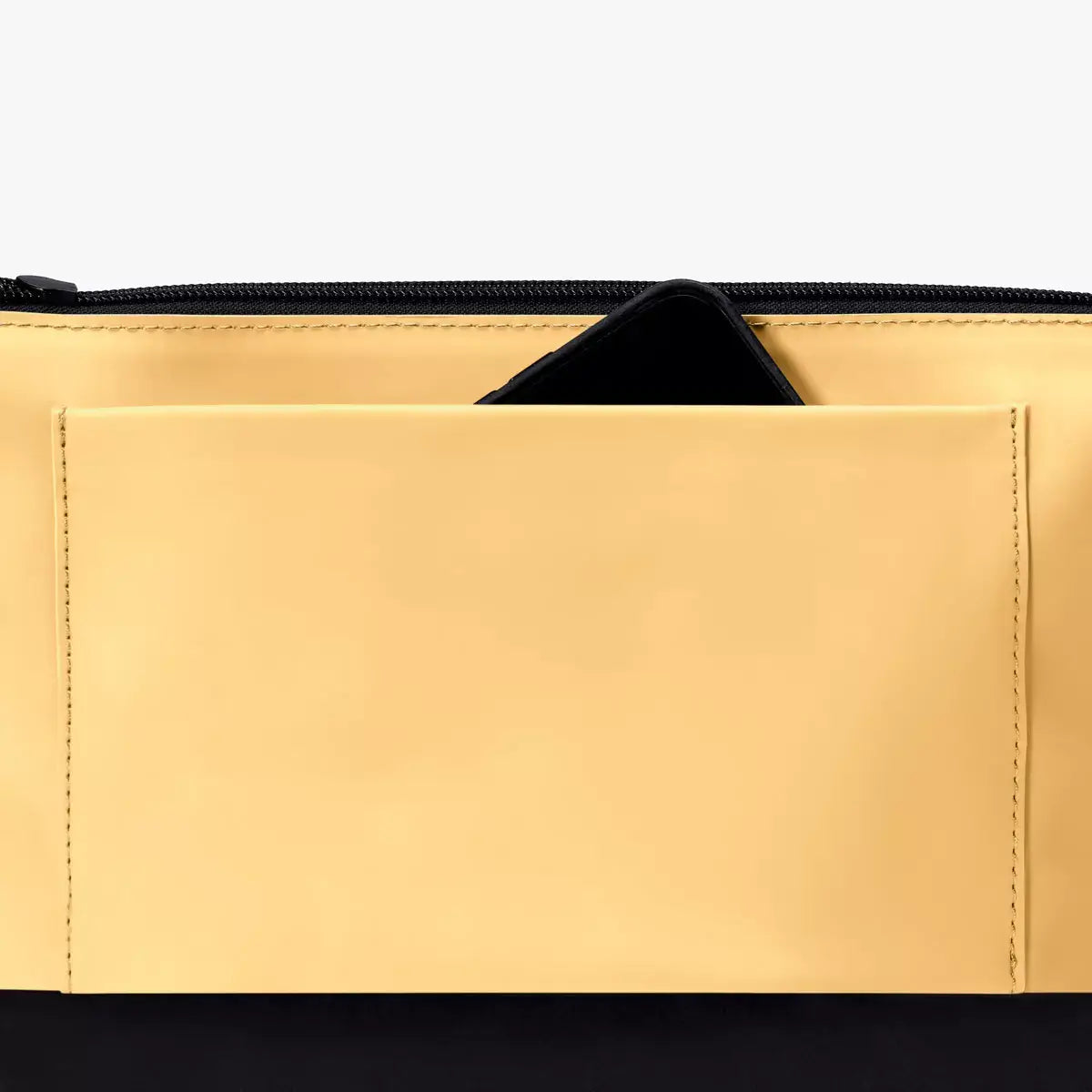 Inside view of Nola Lotus Infinity Lemon Shoulder Bag showcasing its pocket design and durable material.