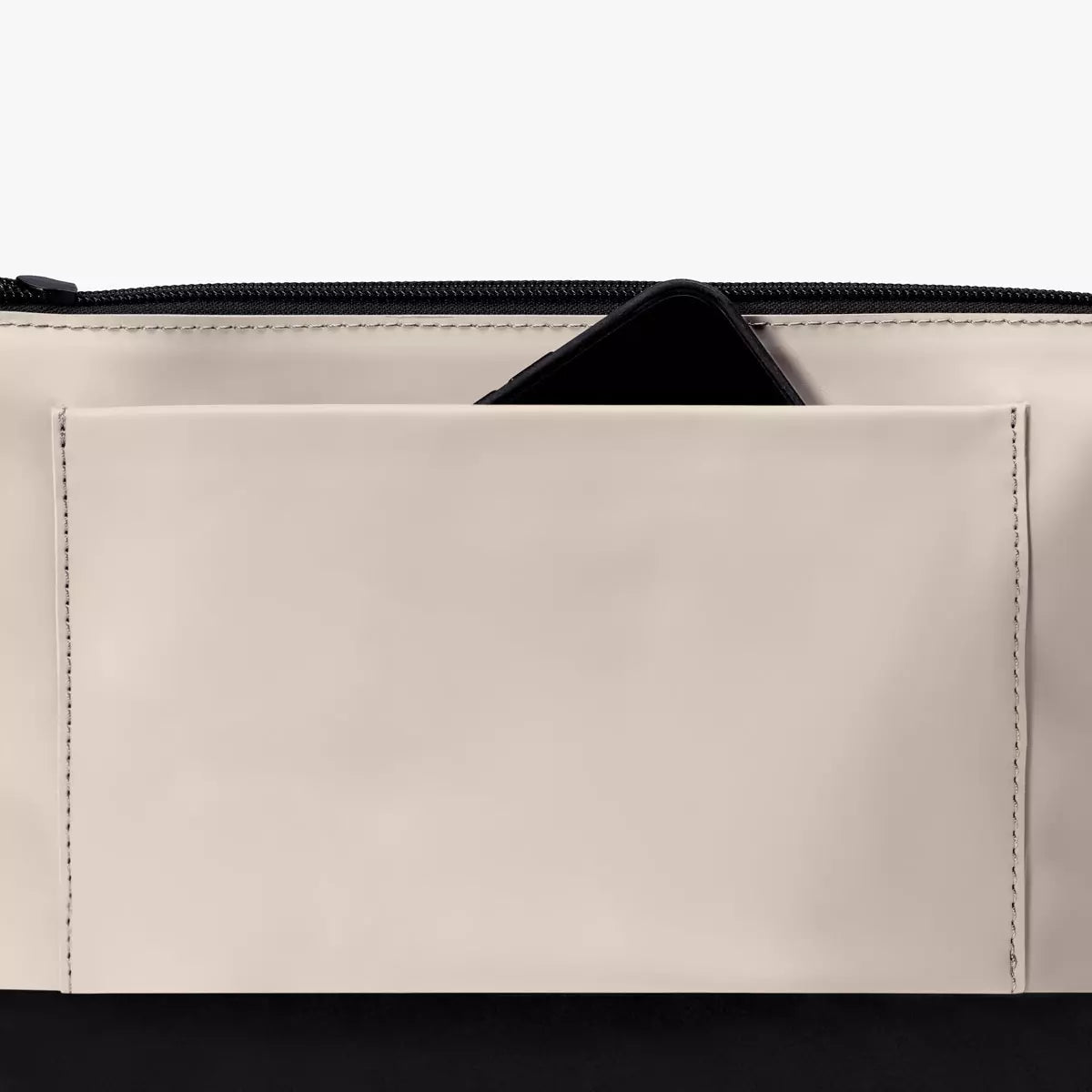Nola Lotus Light Sand Shoulder Bag showing the interior zippered pocket and smartphone.
