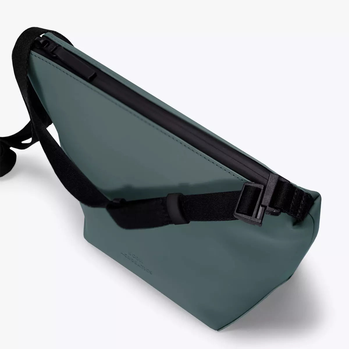 Nola Lotus Pine Green Shoulder Bag showcasing waterproof design with adjustable webbing strap and zipped compartment.