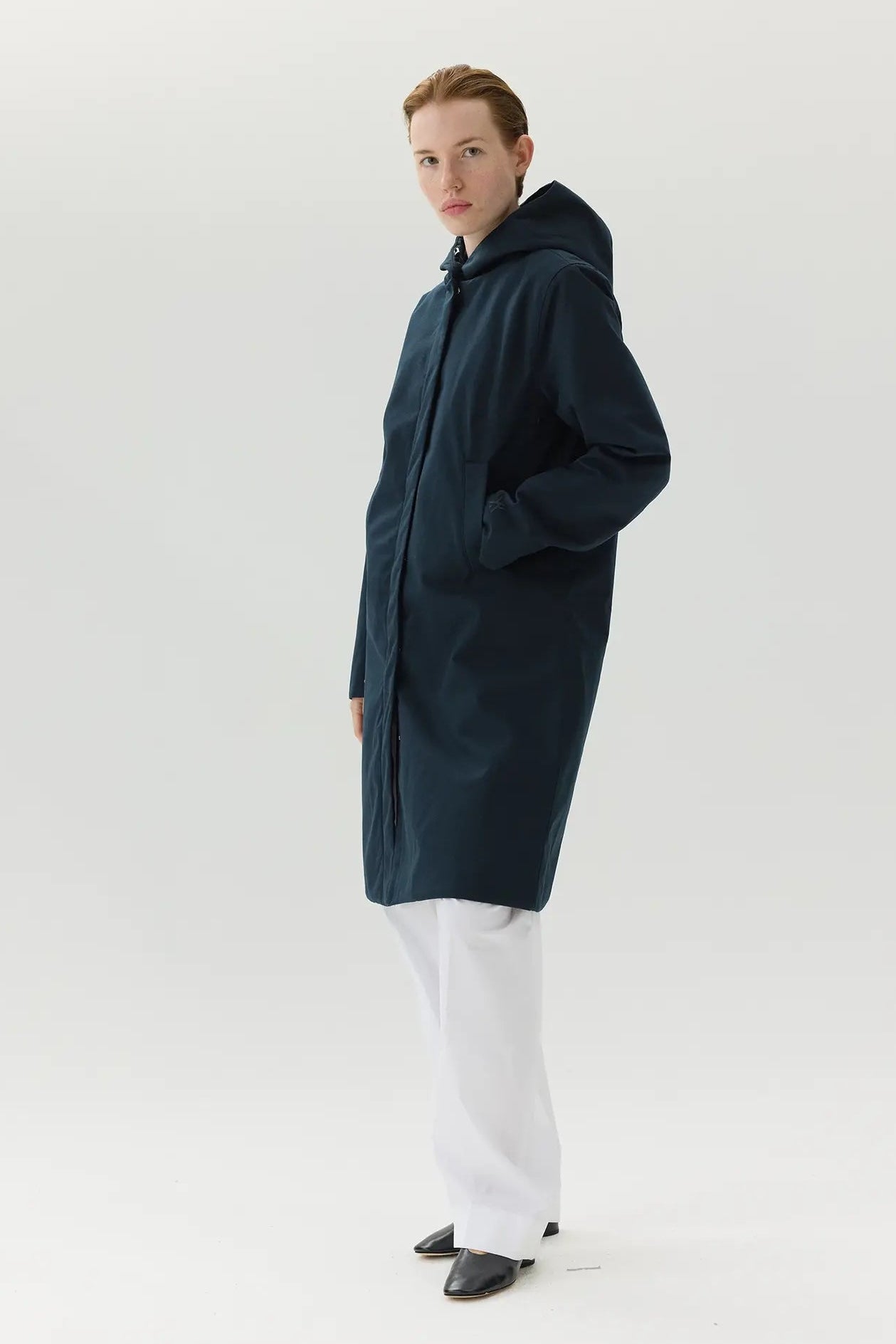 Model wearing Not So Long Tube Spoiler Navy Parka, showcasing its stylish design and functional features.