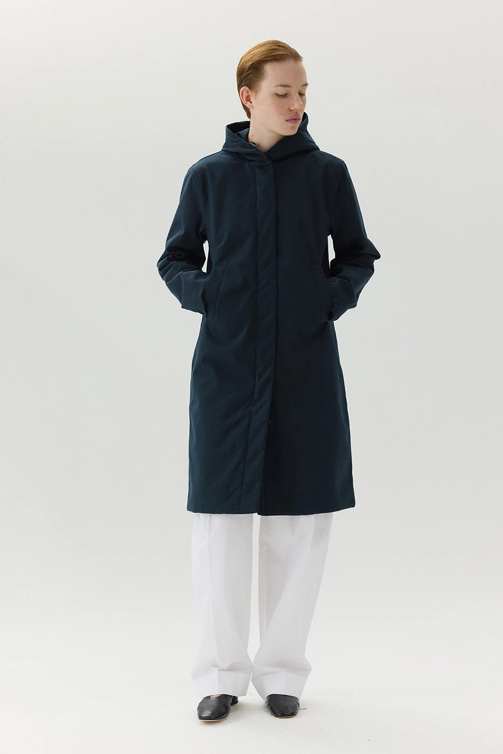 Model wearing Not So Long Tube Spoiler Navy Parka in navy, showcasing its waterproof and breathable features.