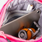 Inside view of the Besace Ecru Matt Coated Bag showing compartments for accessories and a tablet.