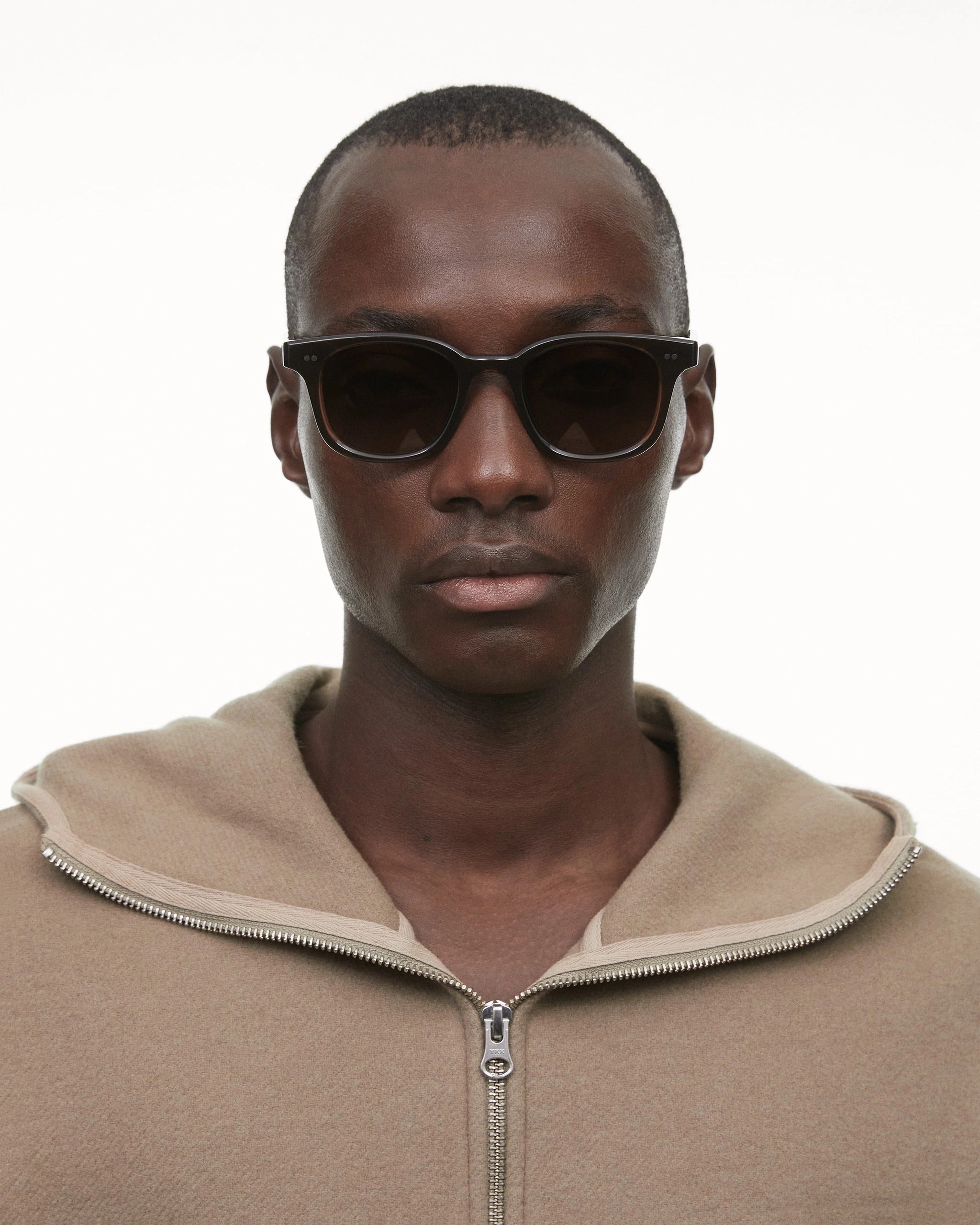 02 Core Brown Sunglasses worn by a model, showcasing high-quality design and stylish fit.