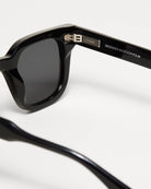 04 Core Black Sunglasses close-up view showing durable frame and anti-scratch lenses, designed in Sweden.