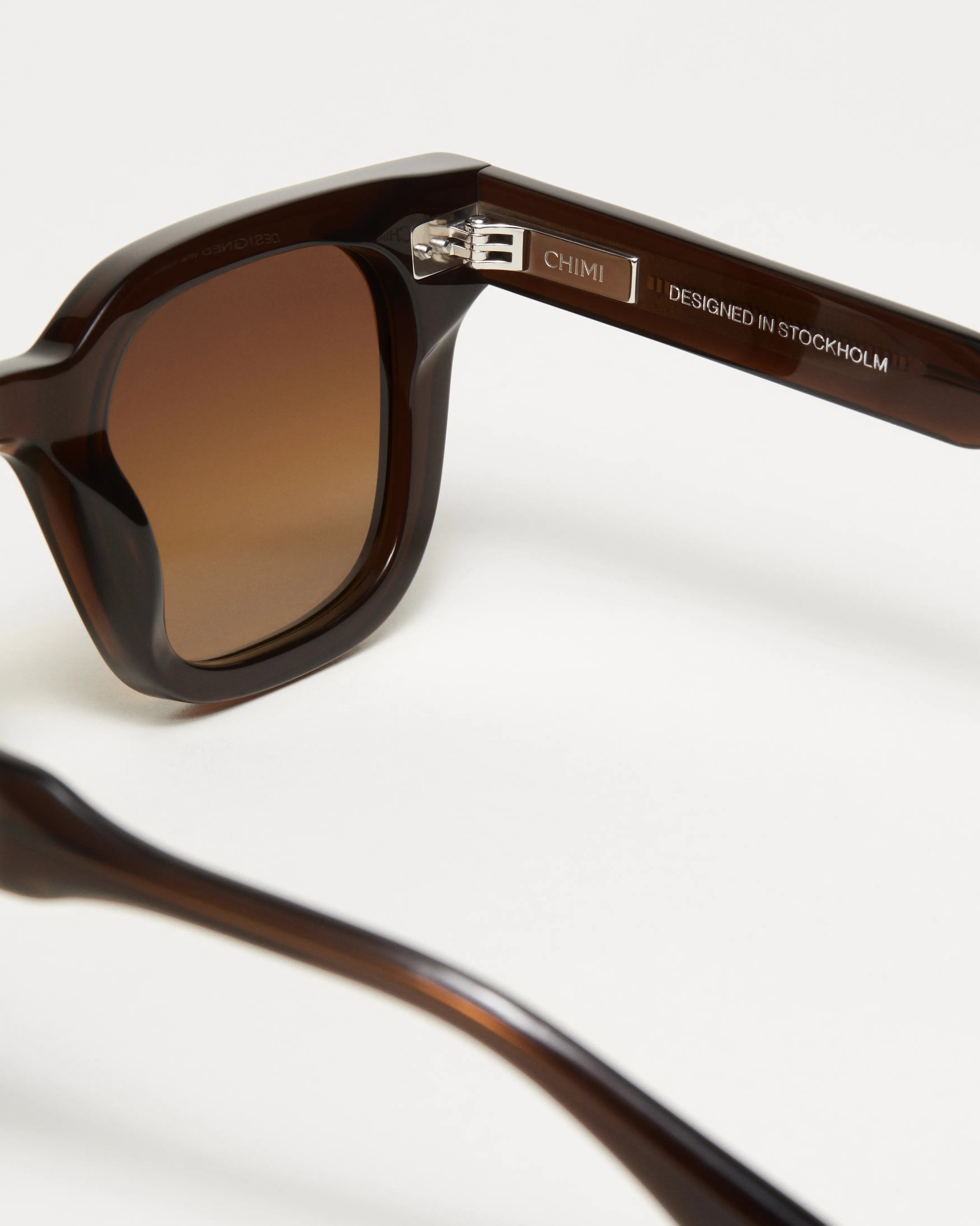 Close-up of 04 Core Brown Sunglasses showcasing the frame and lens design, featuring durable Acetate material.
