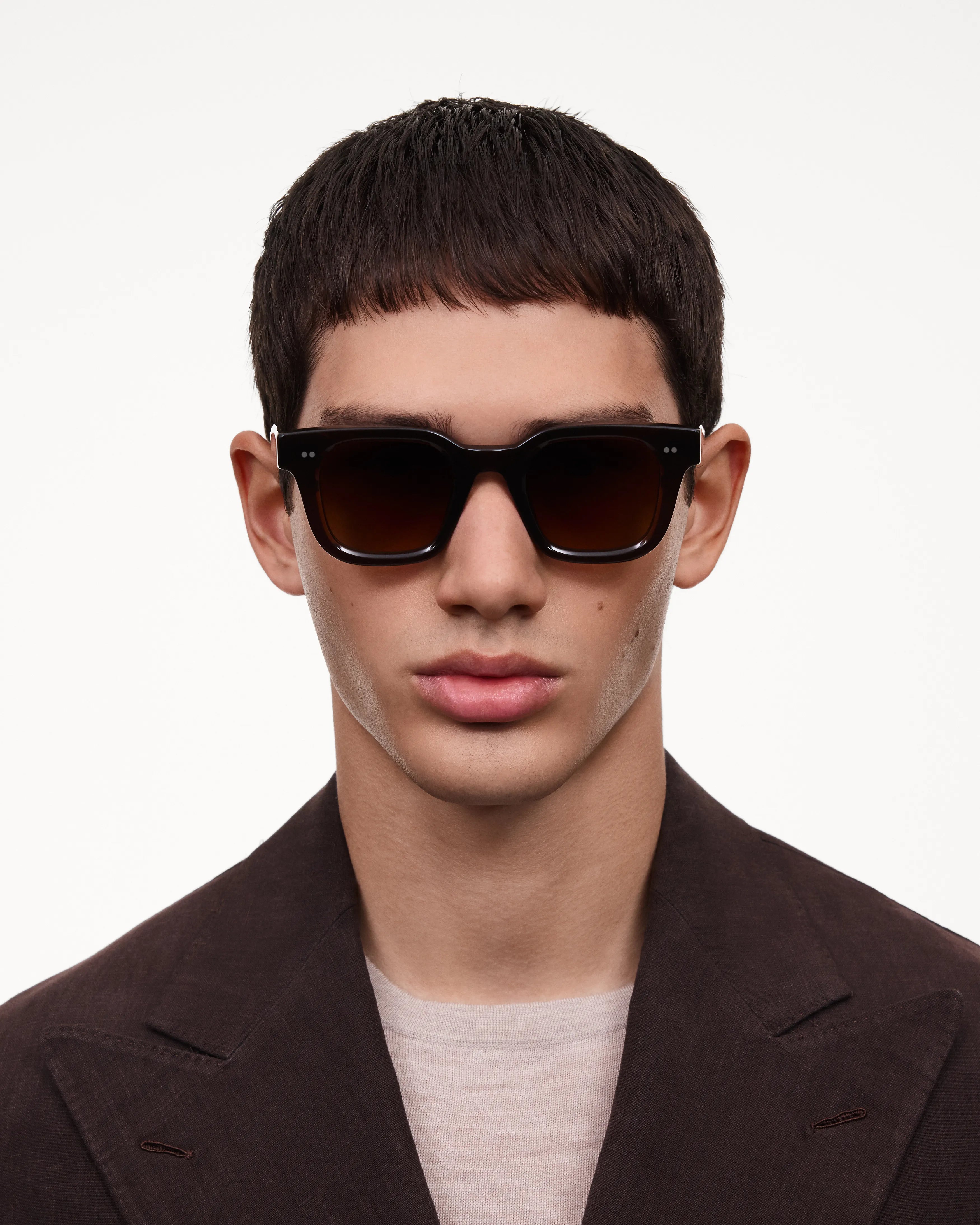 04 Core Brown Sunglasses worn by a model, showcasing style and UV protection, ideal for small to medium heads.