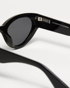 Close-up of 06 Core Black Sunglasses showcasing stylish design and quality lenses, designed in Stockholm.