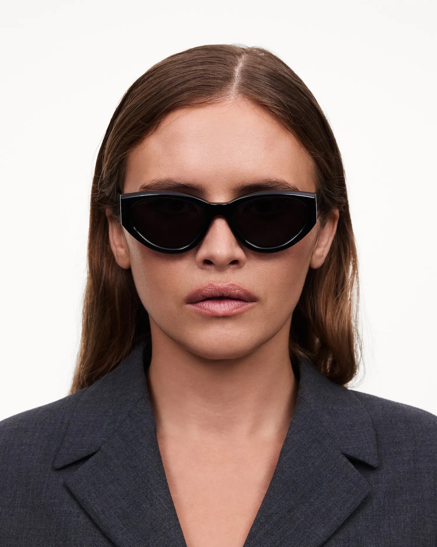 06 Core Black Sunglasses worn by a model, showcasing sleek design and UVA/UVB protection, ideal for everyday use.