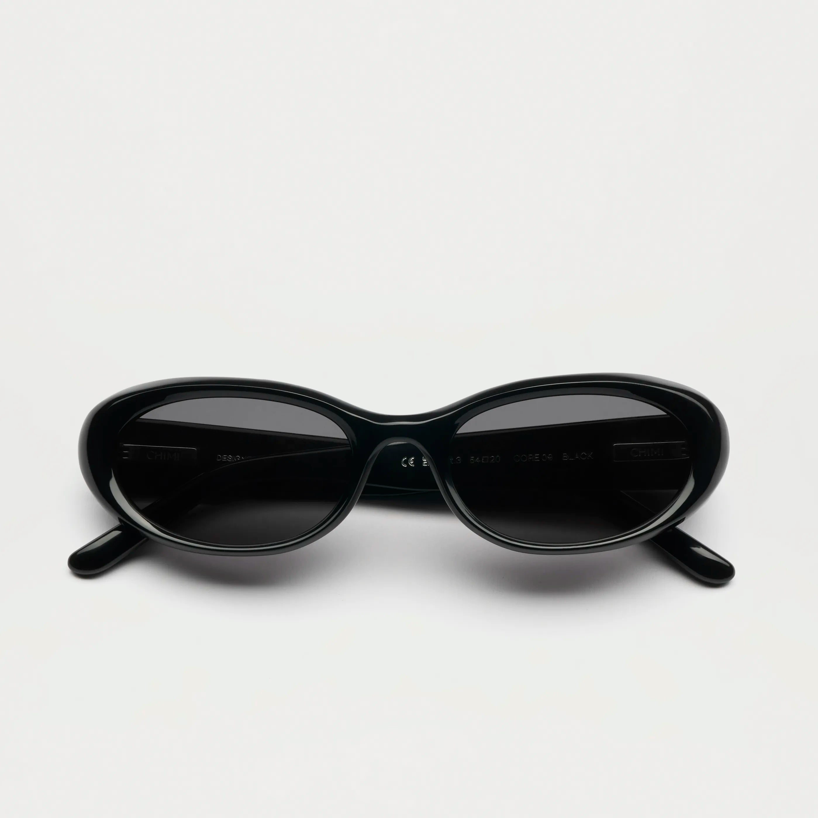 09 Core Black Sunglasses with anti-scratch lenses and UVA + UVB protection, unisex design.