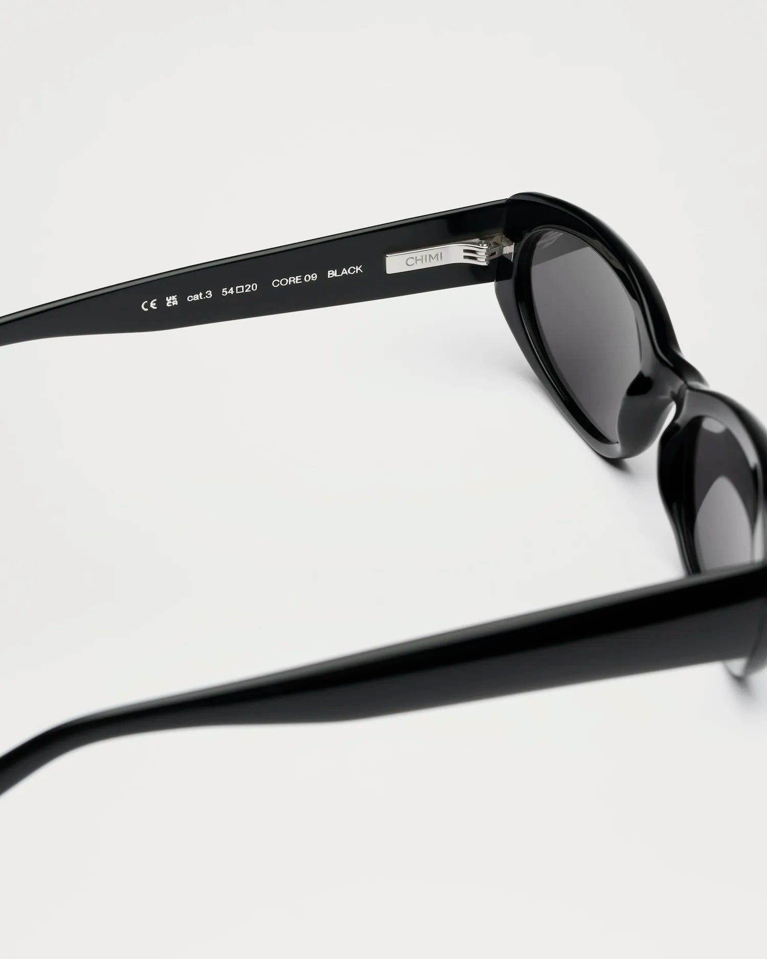 09 Core Black Sunglasses featuring a sleek design and durable materials, showcasing the flexible acetate frames.