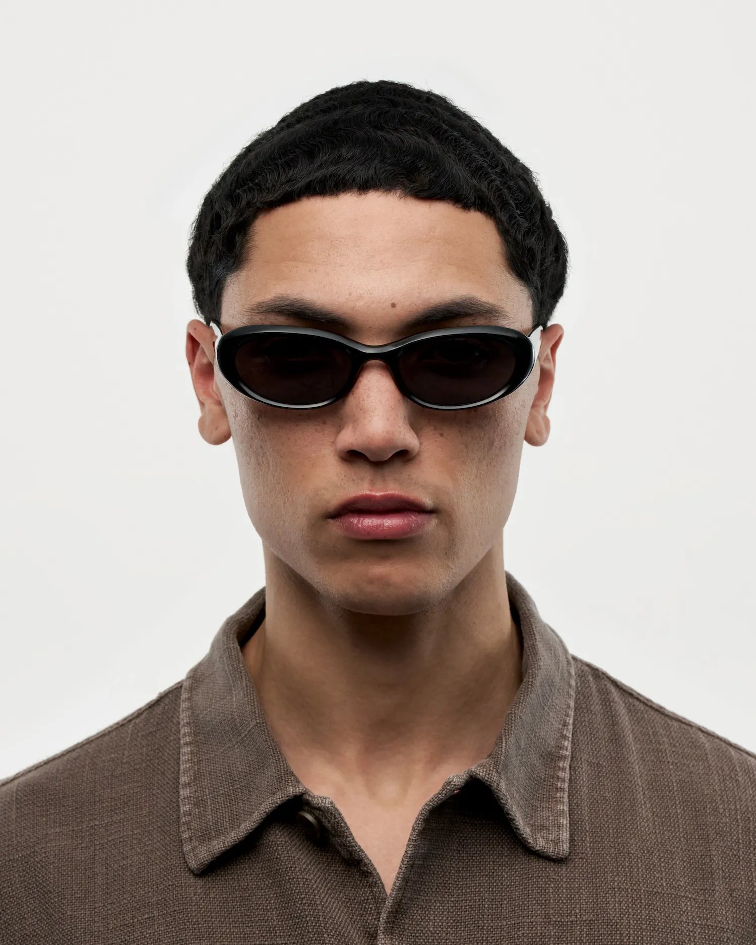 09 Core Black Sunglasses on model, showcasing unisex style and high-quality design with UV protection.