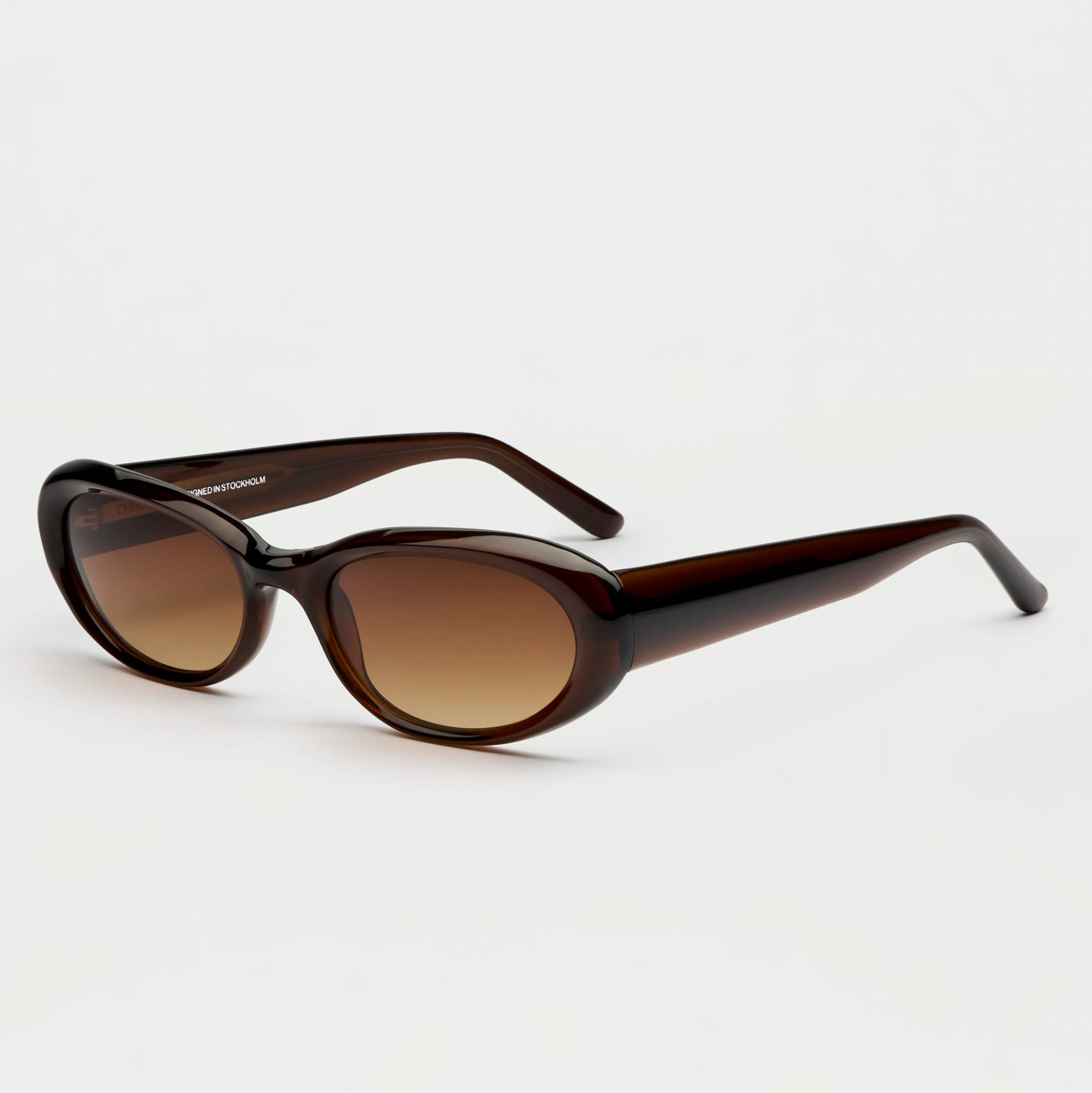 09 Core Brown Sunglasses with durable Acetate, UVA + UVB protection, unisex design, and included case.