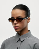 09 Core Brown Sunglasses worn by a model, featuring anti-scratch lenses and durable Acetate material.
