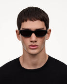 10 Core Black Sunglasses on a model, showcasing stylish design and UV protection.