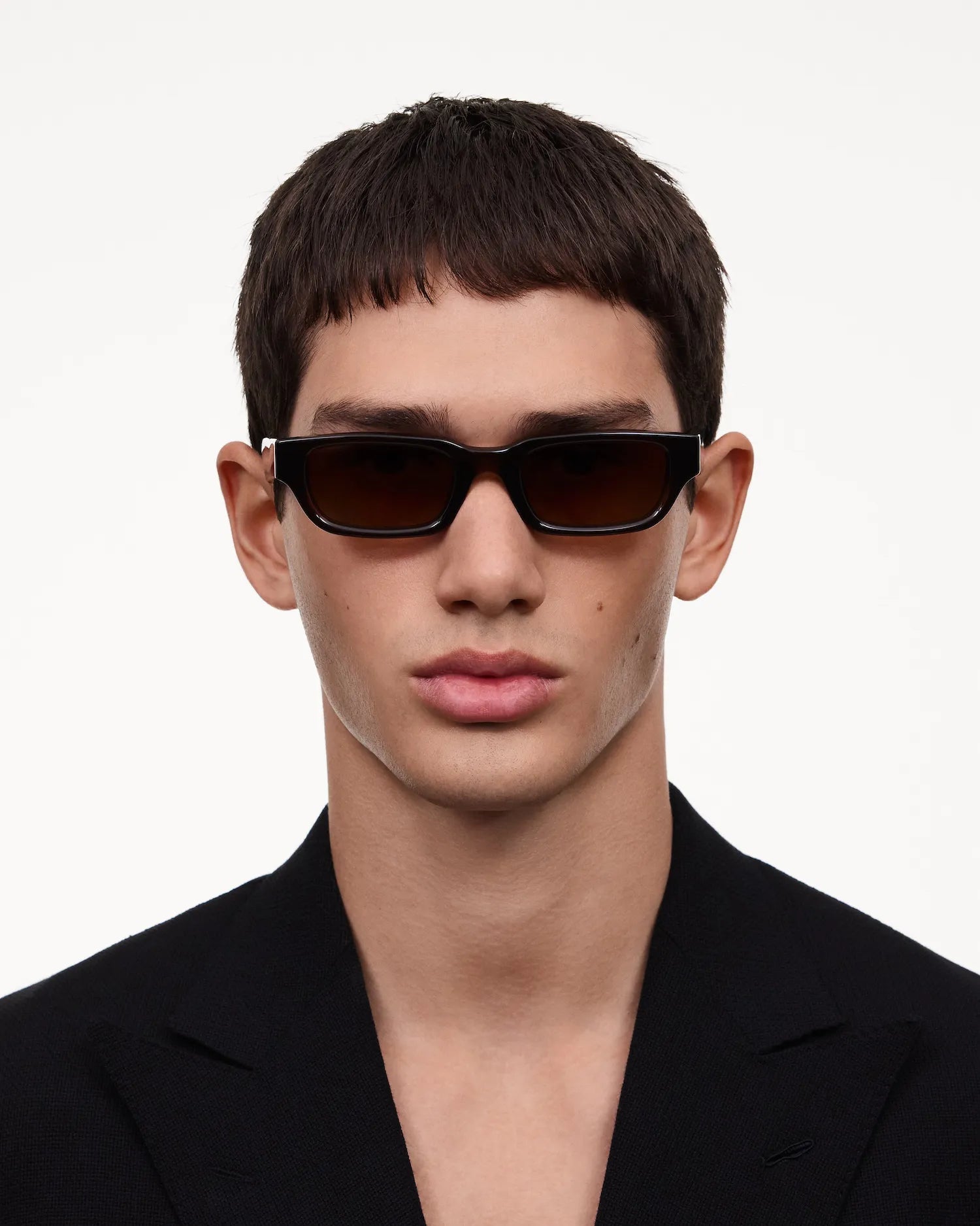 10 Core Brown Sunglasses worn by a model, providing stylish protection with 100% UVA + UVB.