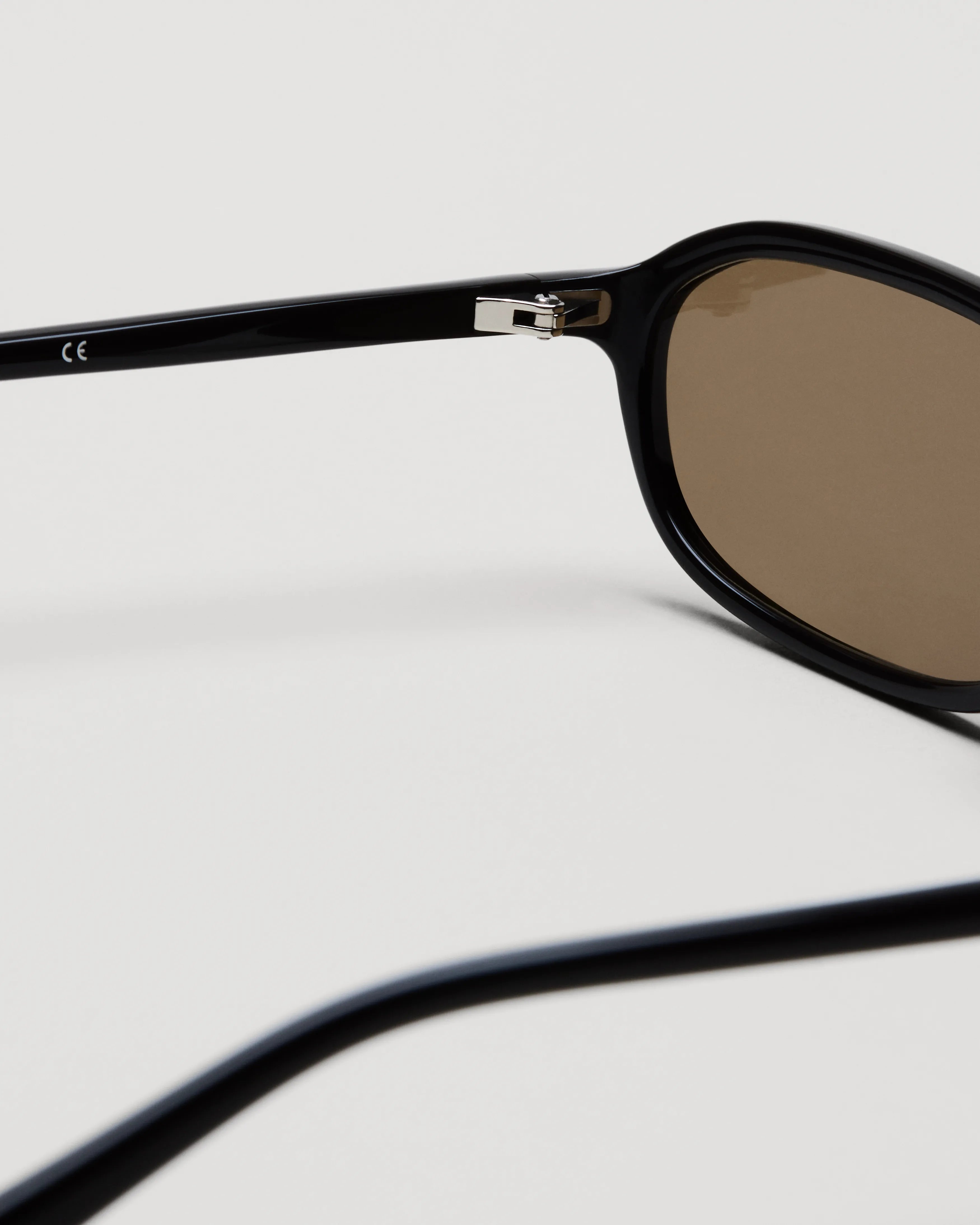 Close-up of the Edith Dark Brown Sunglasses showcasing the frame and lens details.
