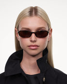 Edith Tortoise Sunglasses worn by a model with straight blonde hair, showcasing stylish frame and fit.