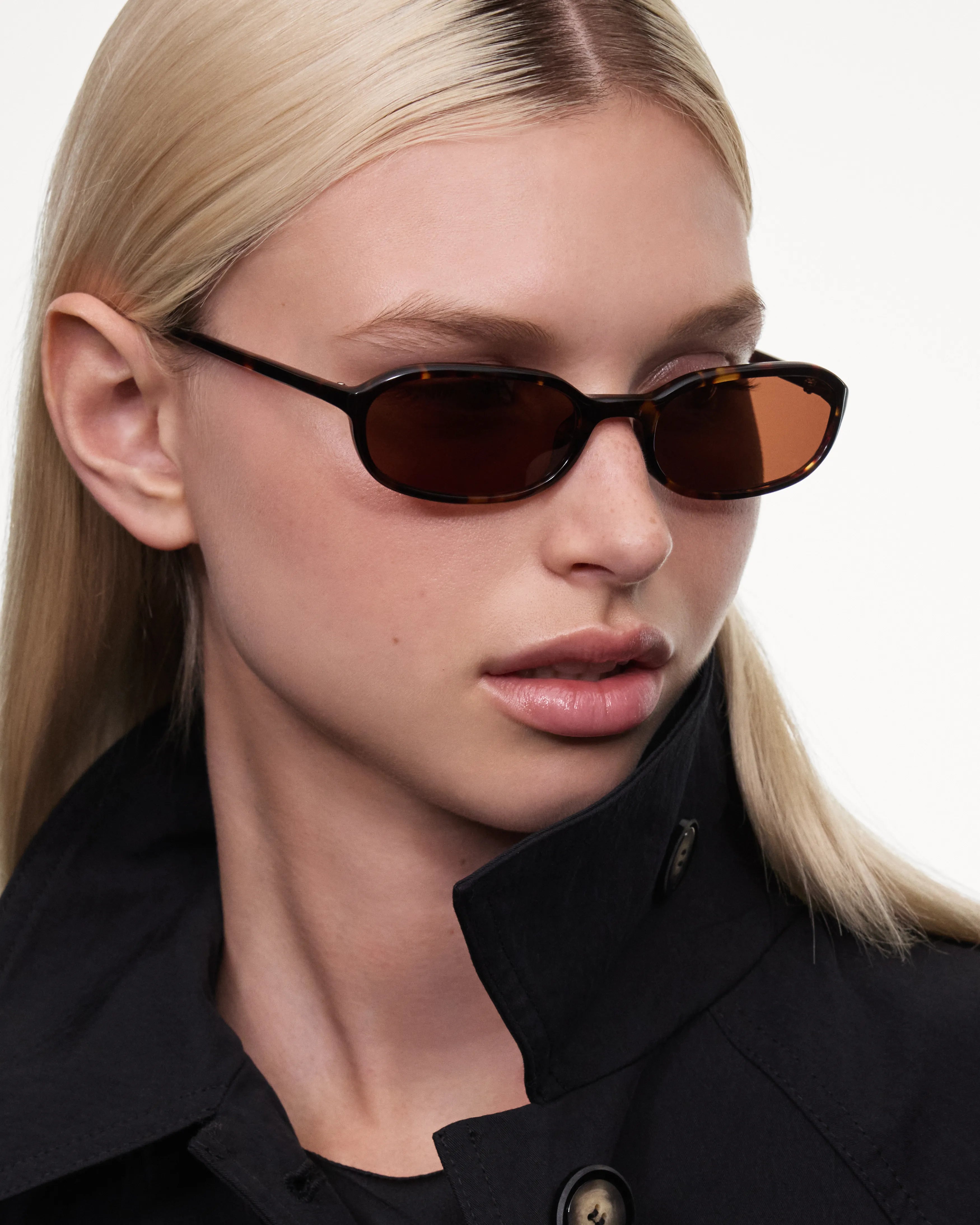 Edith Tortoise Sunglasses worn by a model, showing stylish design and tinted lenses.