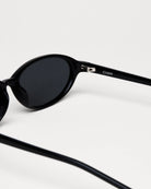 Ellipse Black Sunglasses with sleek design and anti-scratch lenses, featuring Chimi branding and durable Acetate material.