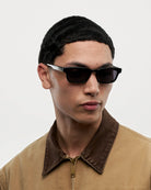 Kasi Black Sunglasses worn by a model showcasing their stylish design and high-quality features.