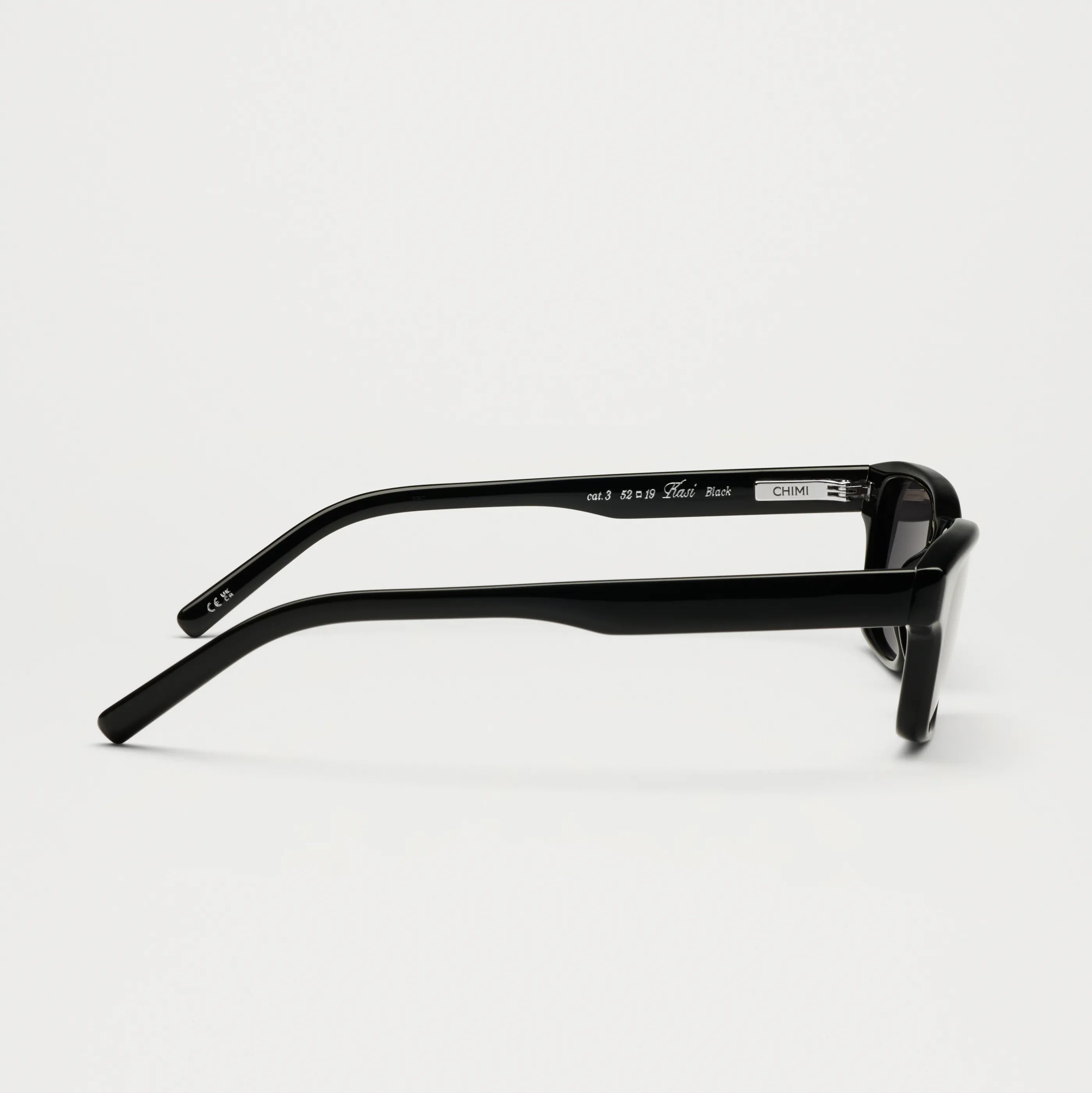 Kasi Black Sunglasses side view showing durable design and flexible fit.