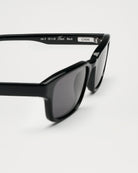 Kasi Black Sunglasses side view showcasing stylish frame and tinted lenses, perfect for eye protection.
