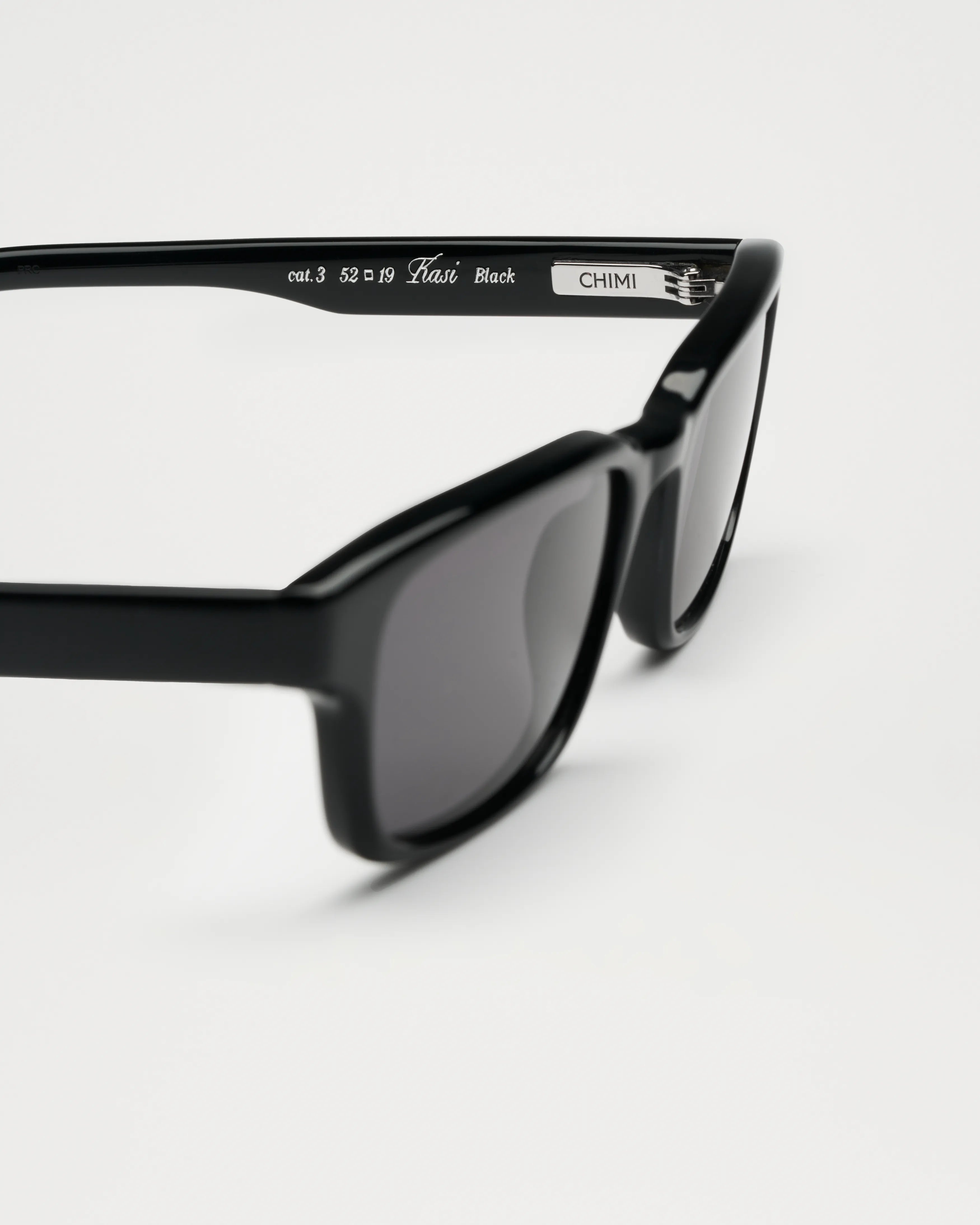 Kasi Black Sunglasses side view showcasing stylish frame and tinted lenses, perfect for eye protection.