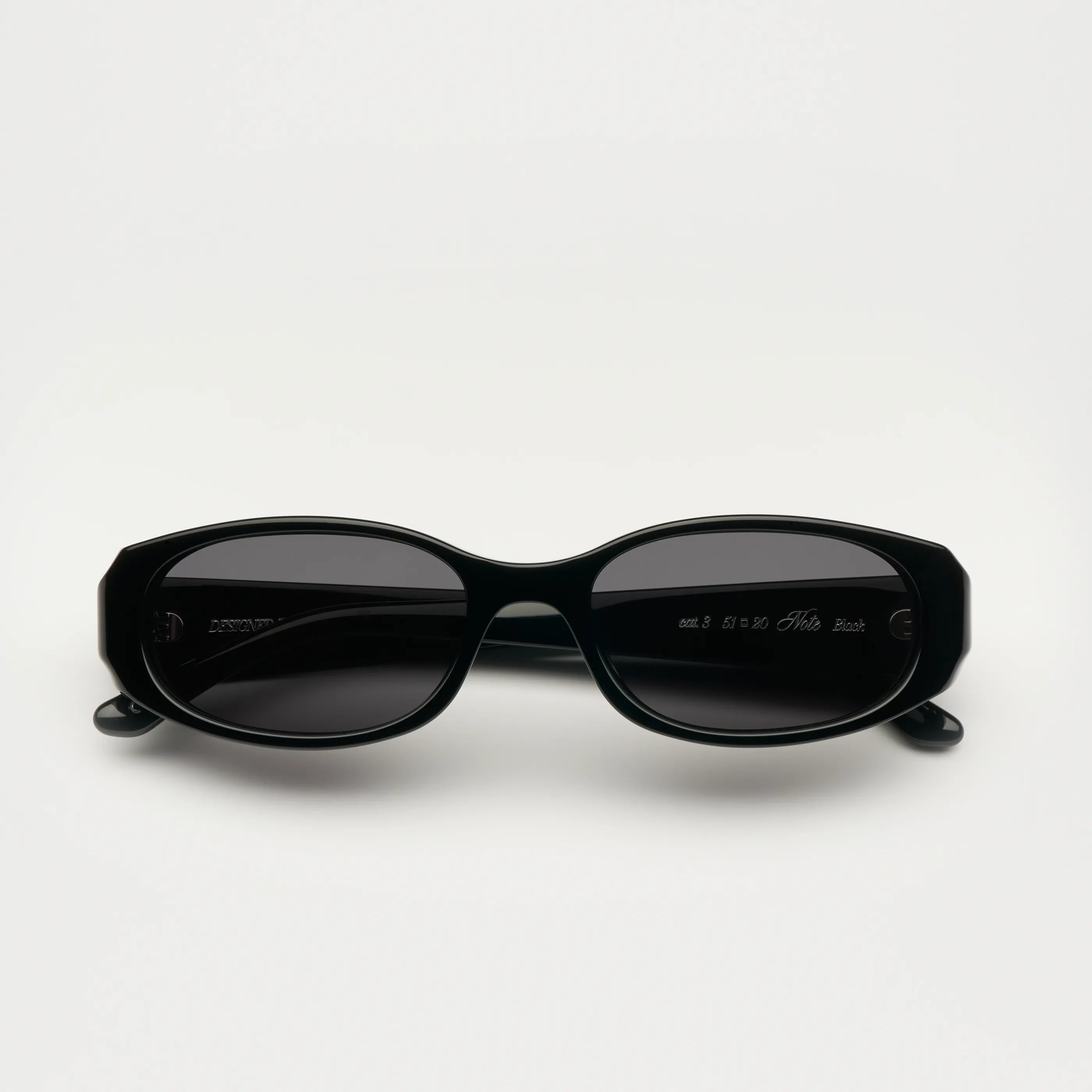 Note Black Sunglasses with anti-scratch lenses, featuring durable Acetate material, ideal for small to medium heads.