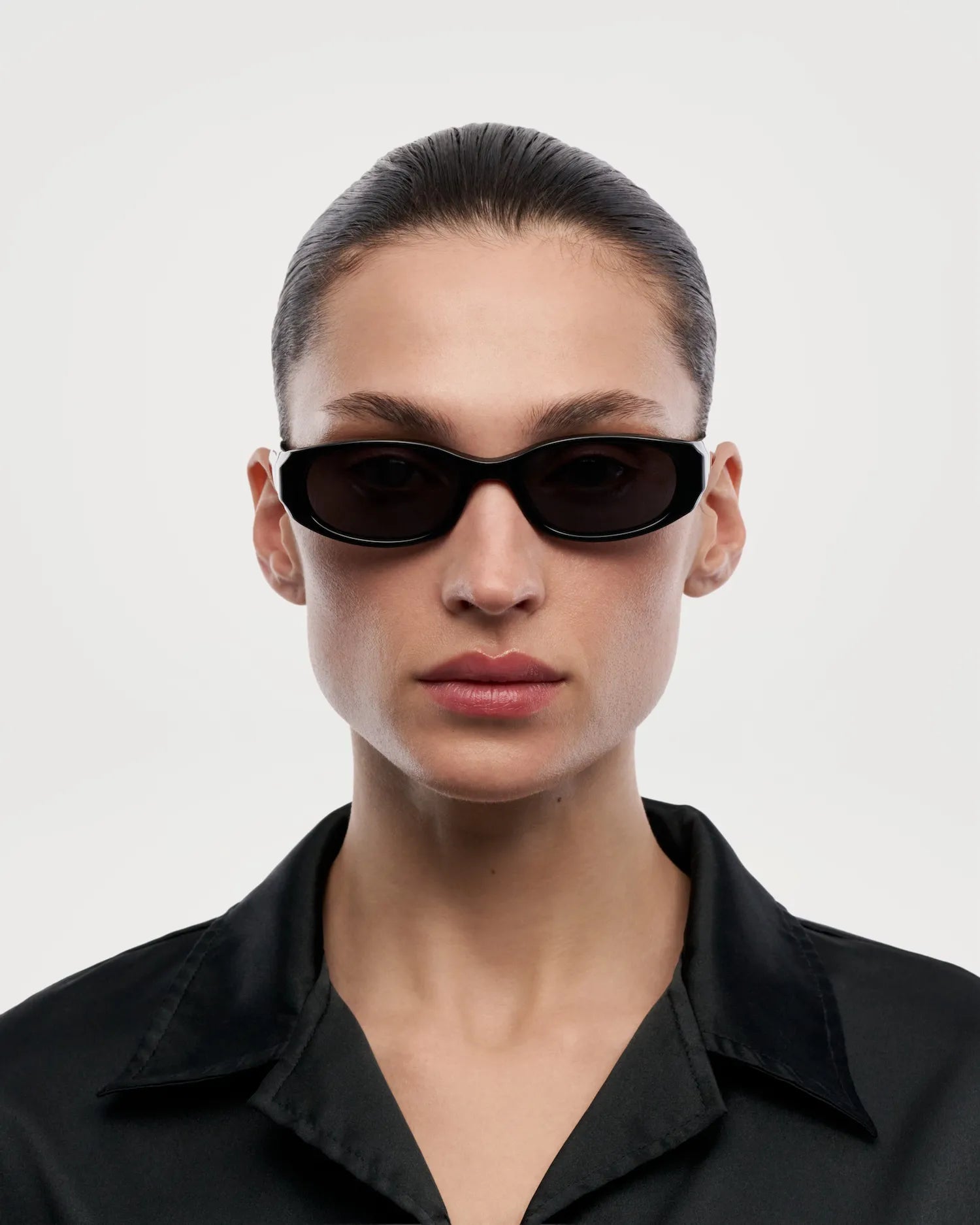 Note Black Sunglasses worn by a model, showcasing stylish design and 100% UVA + UVB protection.