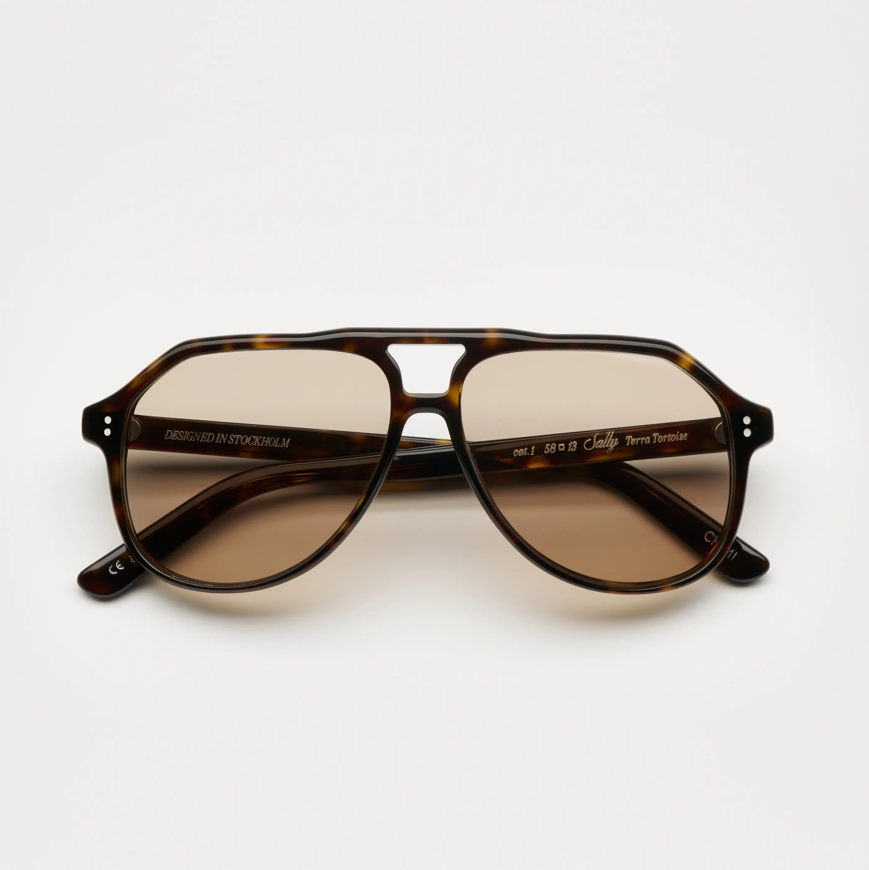 Sally Terra Tortoise Sunglasses featuring anti-scratch lenses and durable Acetate material, designed in Sweden.