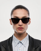 Savy Black Sunglasses model wearing stylish shades with a confident expression against a plain background.