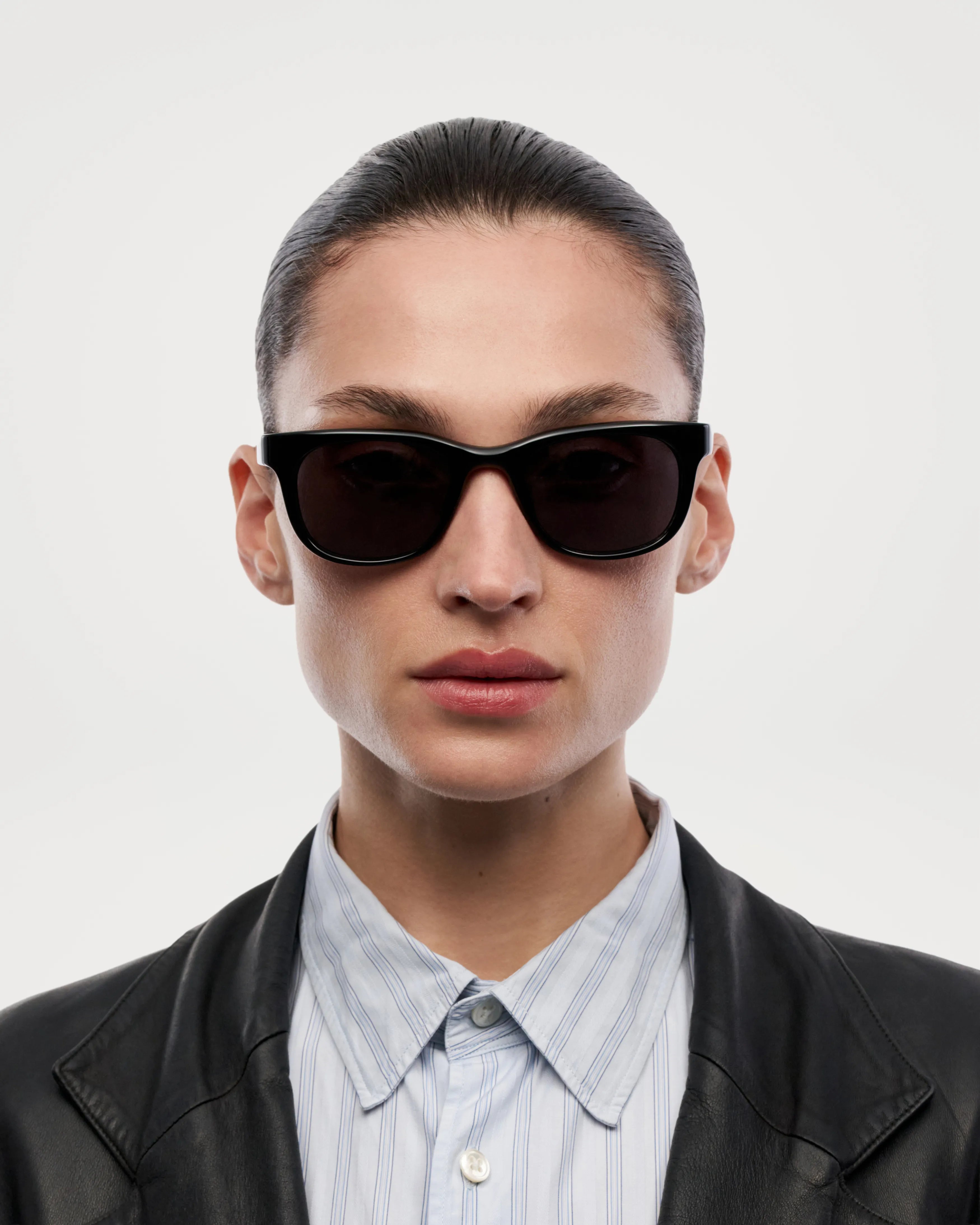 Savy Black Sunglasses model wearing stylish shades with a confident expression against a plain background.
