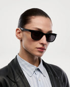 Savy Black Sunglasses on a model showcasing a stylish design and modern look, perfect for UV protection and durability.