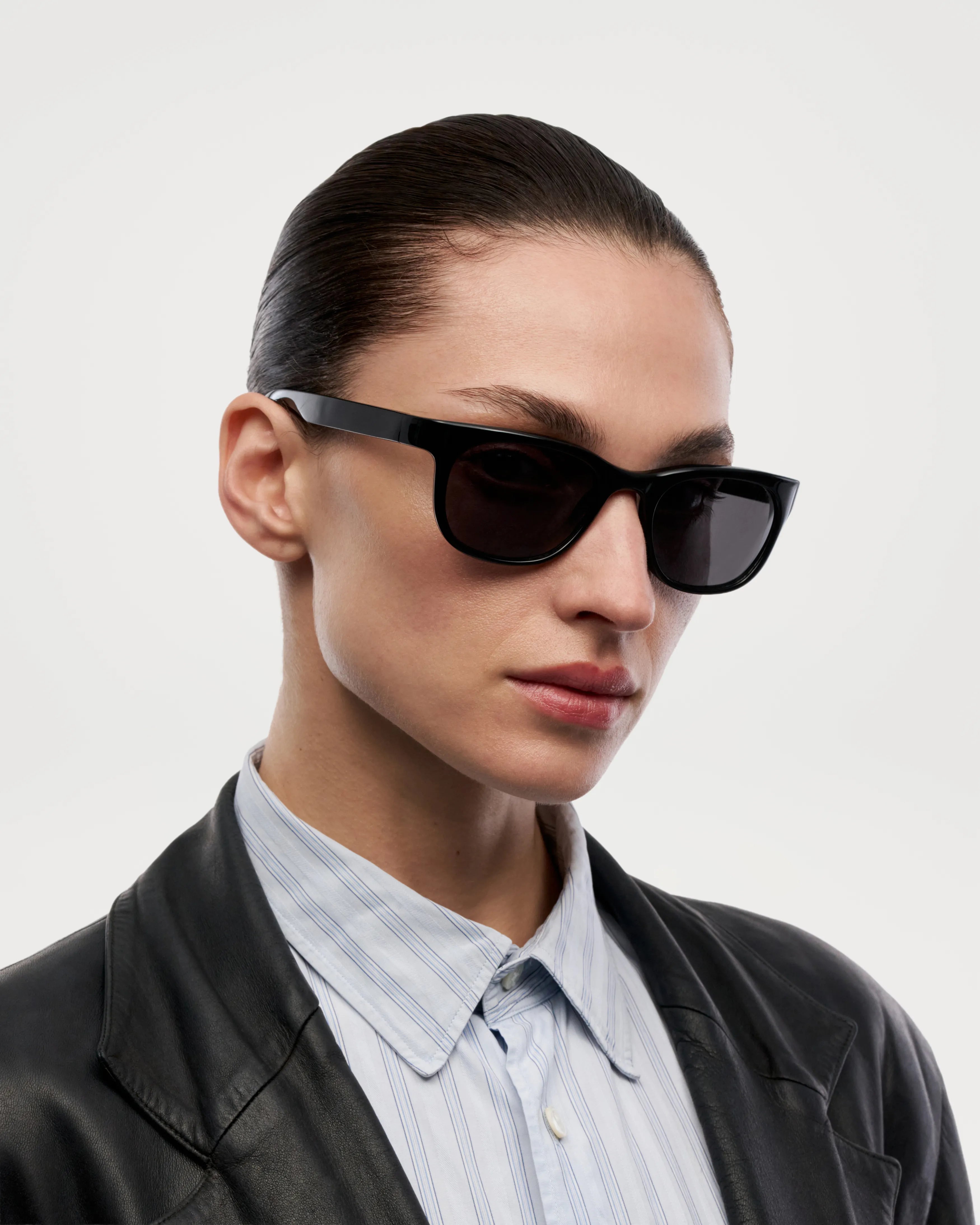 Savy Black Sunglasses on a model showcasing a stylish design and modern look, perfect for UV protection and durability.