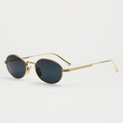 Oval Gold Sunglasses with UV 400 protection, eco-friendly frame, and scratch-resistant lenses.