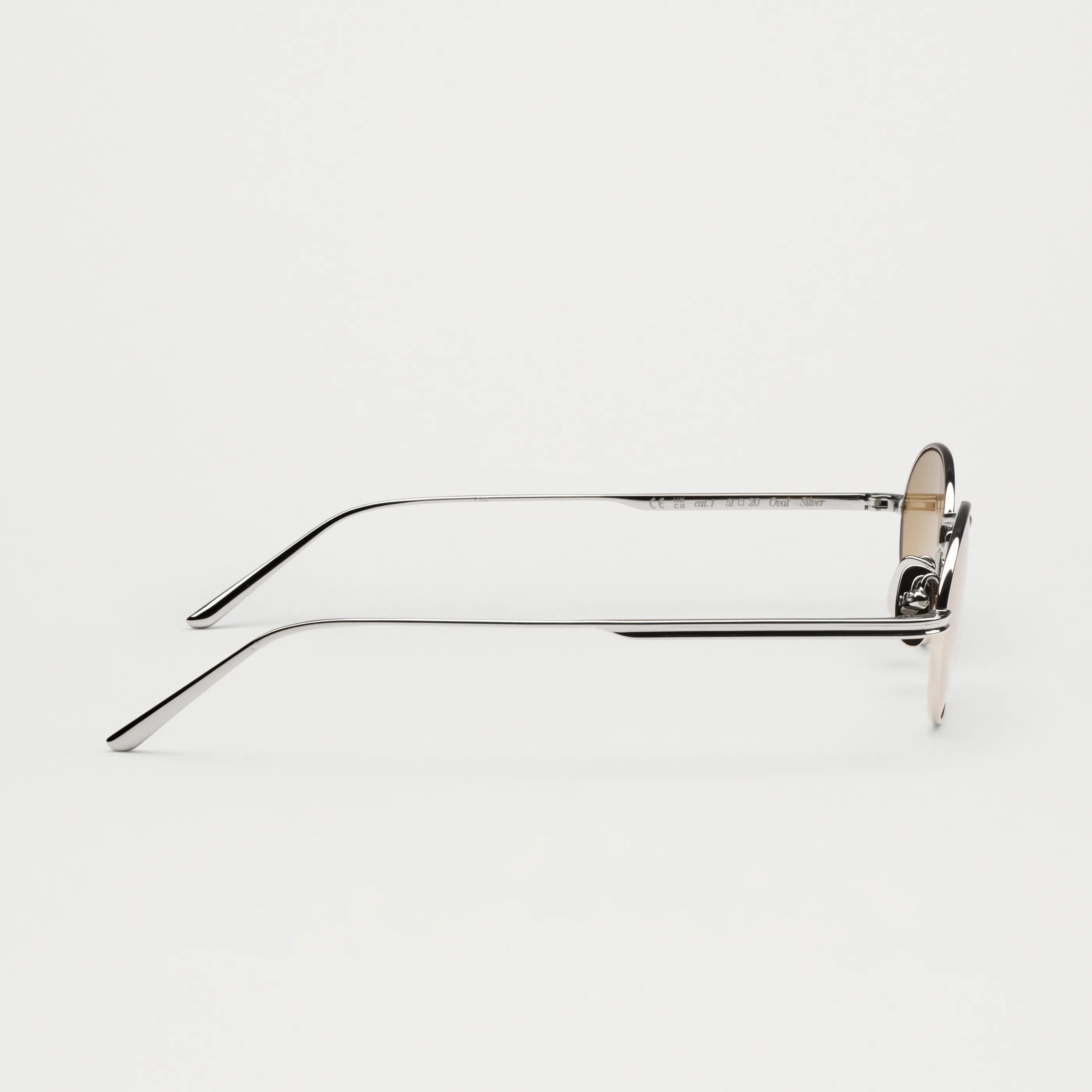 Profile view of Oval Silver Sunglasses showcasing the sleek design and eco-friendly materials.