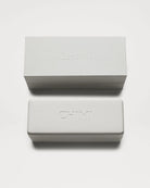 Branded CHIMI sunglasses cases stacked, featuring sleek white design and embossed logo, perfect for sunglasses storage.