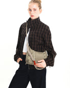 Model showcasing the Cloud Hobo XS Cocoa Vintage Ripstop Shoulder Bag with a stylish outfit.