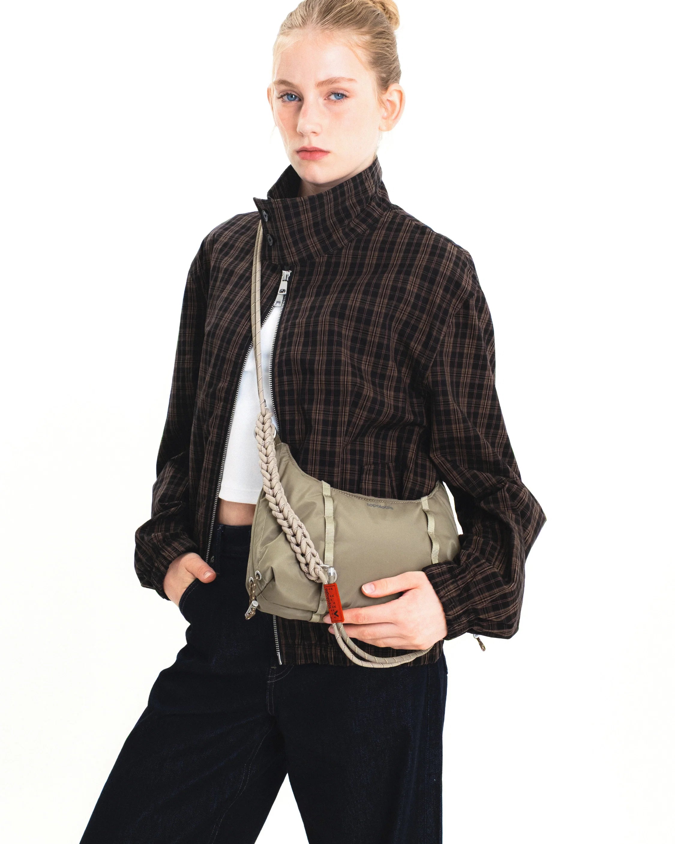 Model showcasing the Cloud Hobo XS Cocoa Vintage Ripstop Shoulder Bag with a stylish outfit.