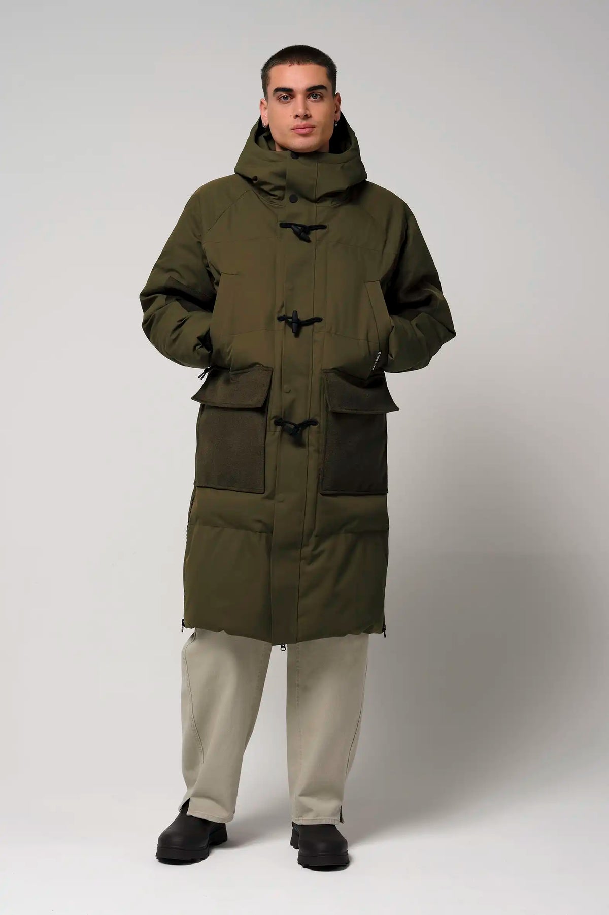 Barack Dark Olive Green Parka displayed on a model, showcasing its waterproof and windproof features.