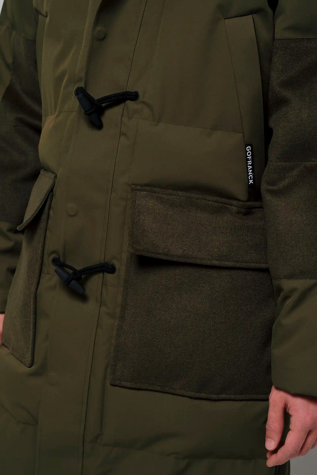 Barack Dark Olive Green Parka featuring durable pockets and stylish design, ideal for inclement weather.