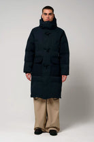 Barack Sky Captain Blue Parka shown in a model wearing a warm, waterproof coat with multiple pockets and an adjustable hood.