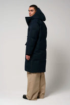 Barack Sky Captain Blue Parka worn by a model showcasing the back view, featuring a hood and adjustable design.
